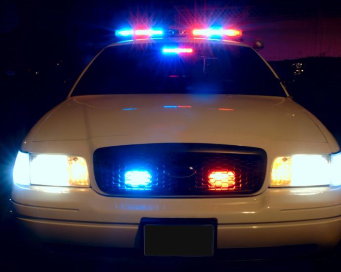 "Police Car Lights" by davidsonscott15 is licensed under CC BY 2.0.